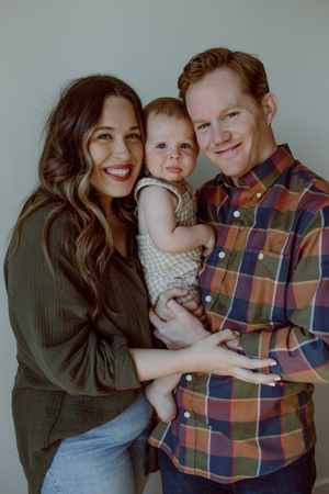 Family photo of Auggie, Mom, and Dad