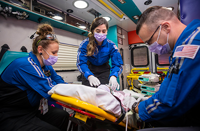 Dr. Jennifer Ruiz working with members of Children’s Mercy’s critical care transport team.